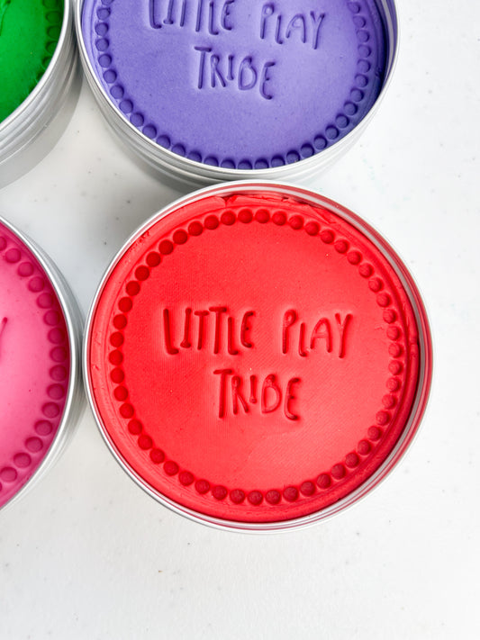 7 pots of coloured playdough in 250g maxi tubs for sensory play. Screen Free eco friendly sensory dough with scented coloured playdough. Red playdough with Little Play Tribe imprint