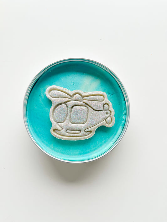 Tins of Blue Playdough with glitter transport themed topper for themed alternative eco friendly party bag fillers. Helicopter dough