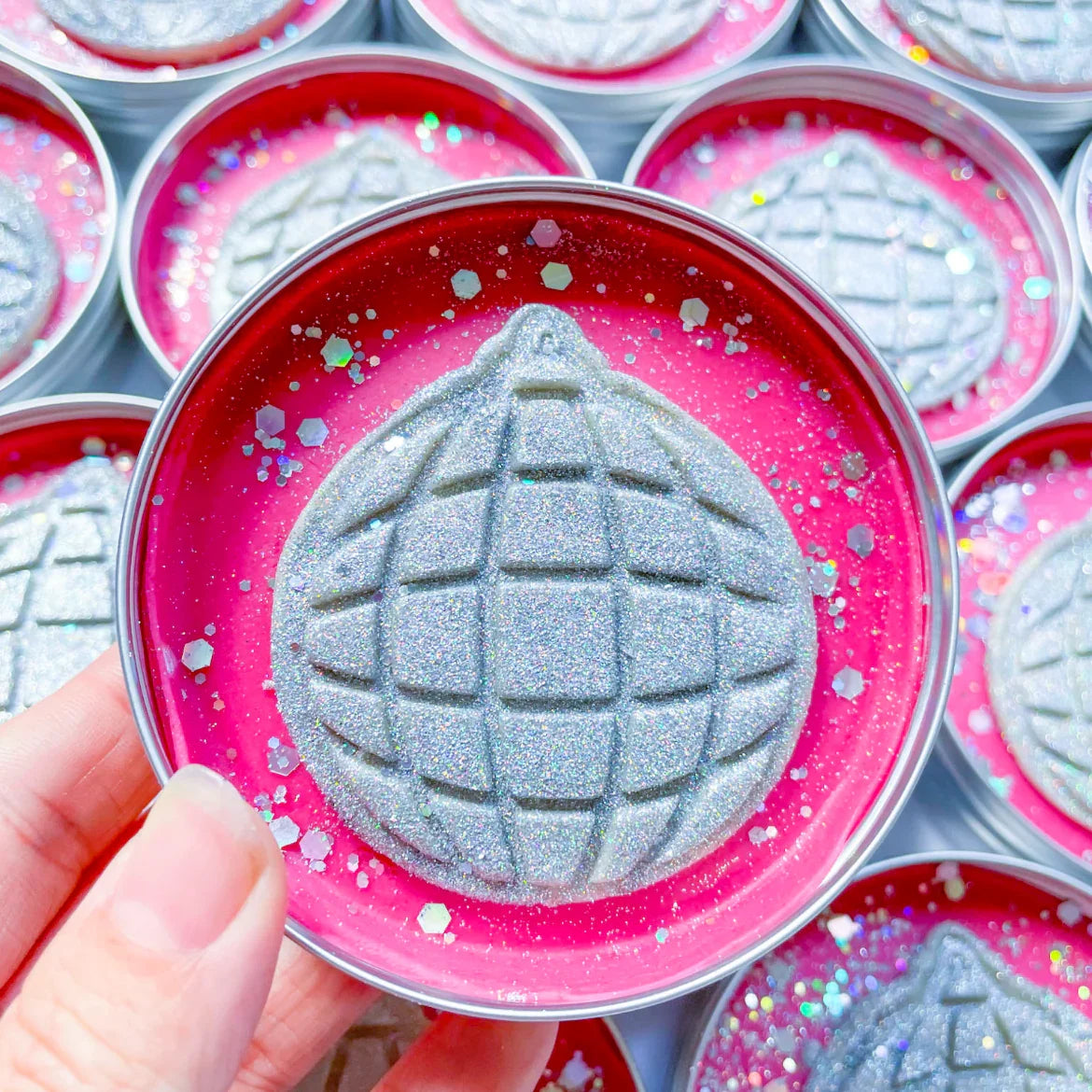 Disco ball theme party pots. Tins with pink playdough topped with silver glitter disco ball cutout dough for disco themed party bag fillers