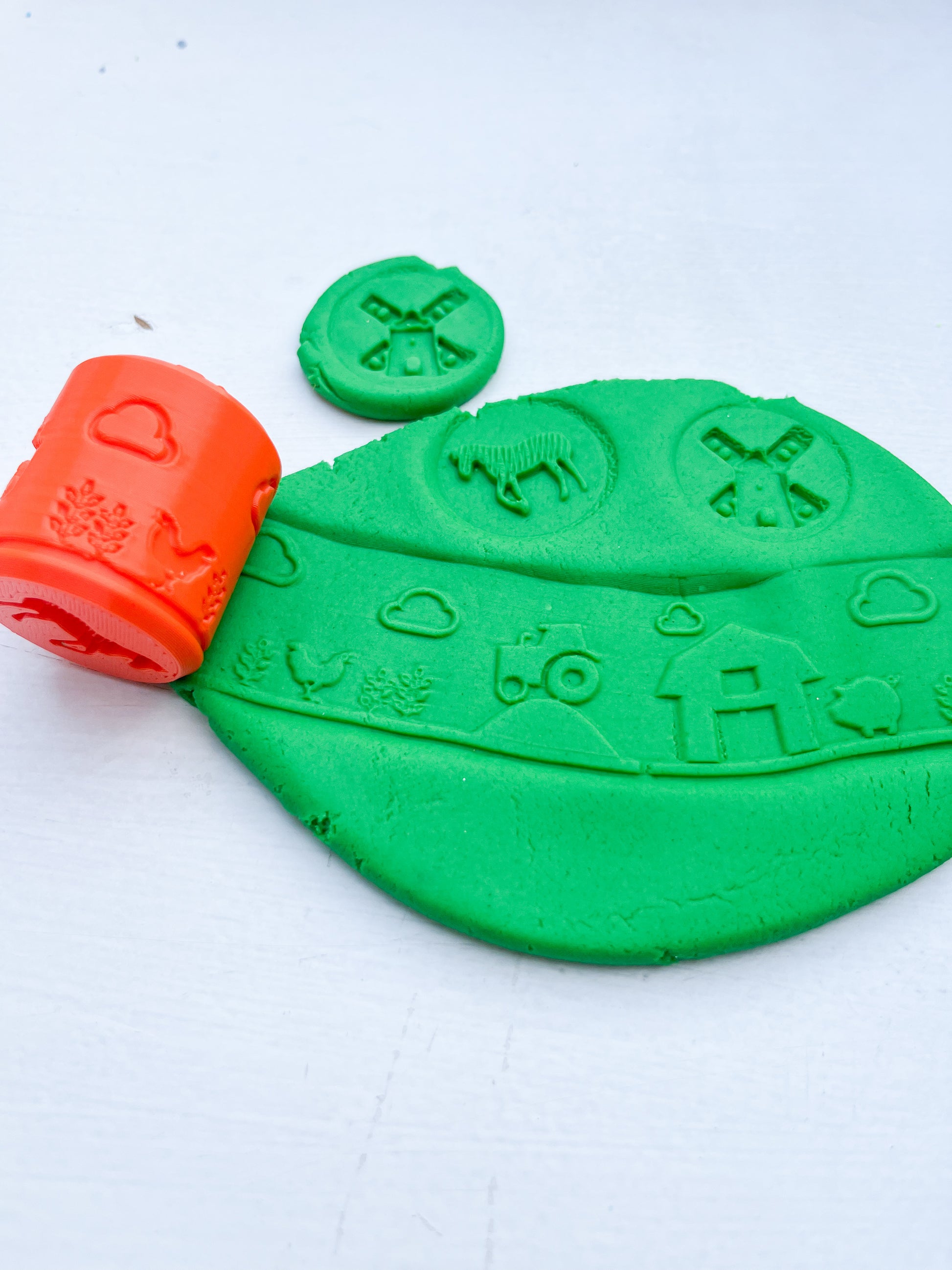 Red Farm Eco Playdough roller with green grass coloured and scented sensory dough. Play tools and accessory for farm themed play