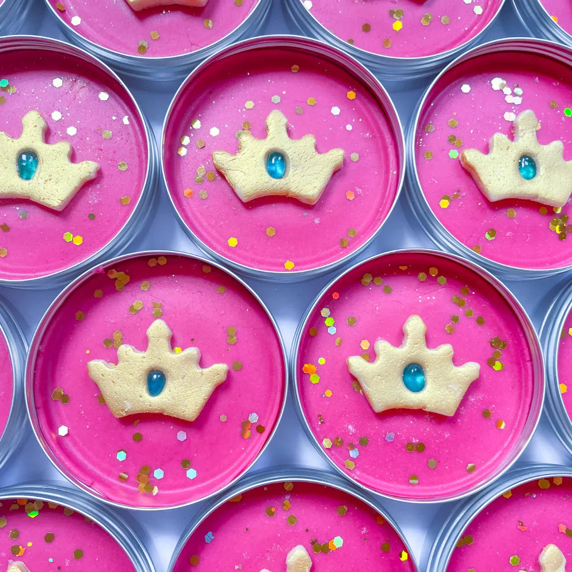 Princess Themed Pink Playdough pots with gold glitter crowns on top for alternative eco friendly party bag fillers