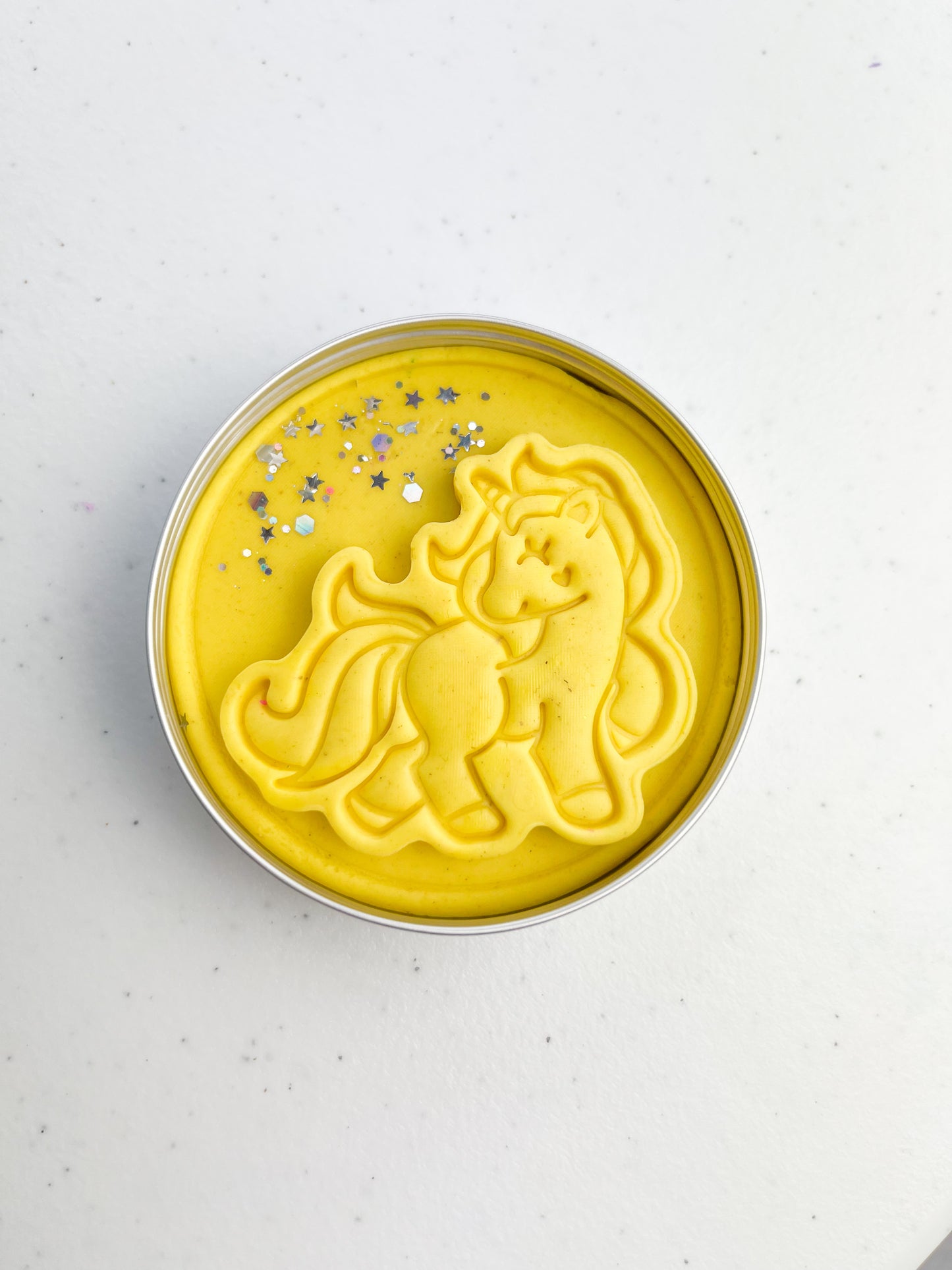 Tin of yellow Playdough with unicorn design perfect for unicorn themed birthday party favours