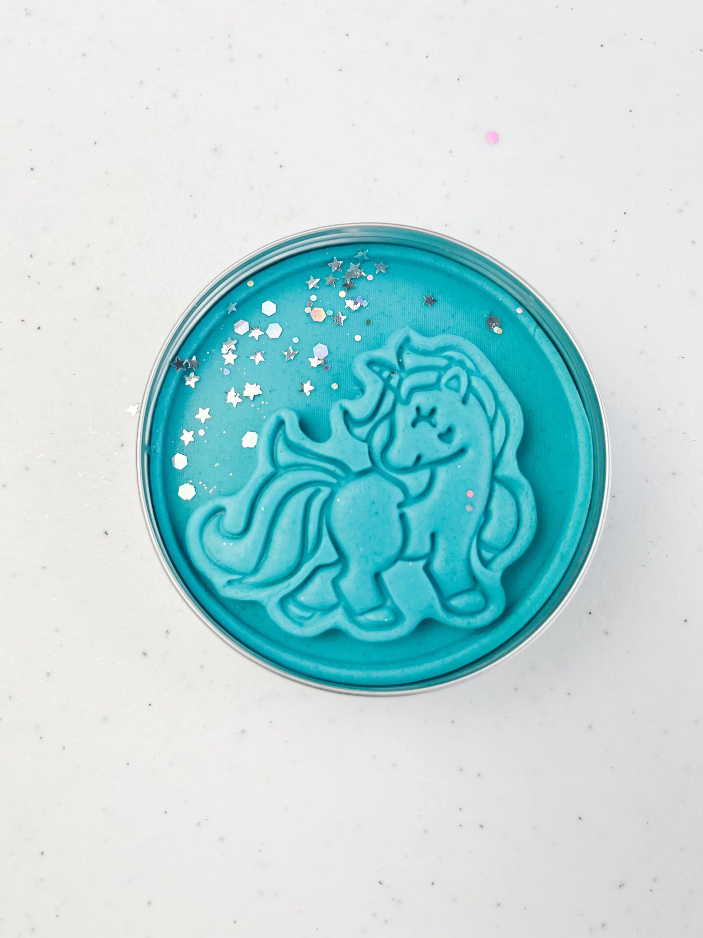 Tin of blue Playdough with unicorn design for unicorn themed kids birthday party favours