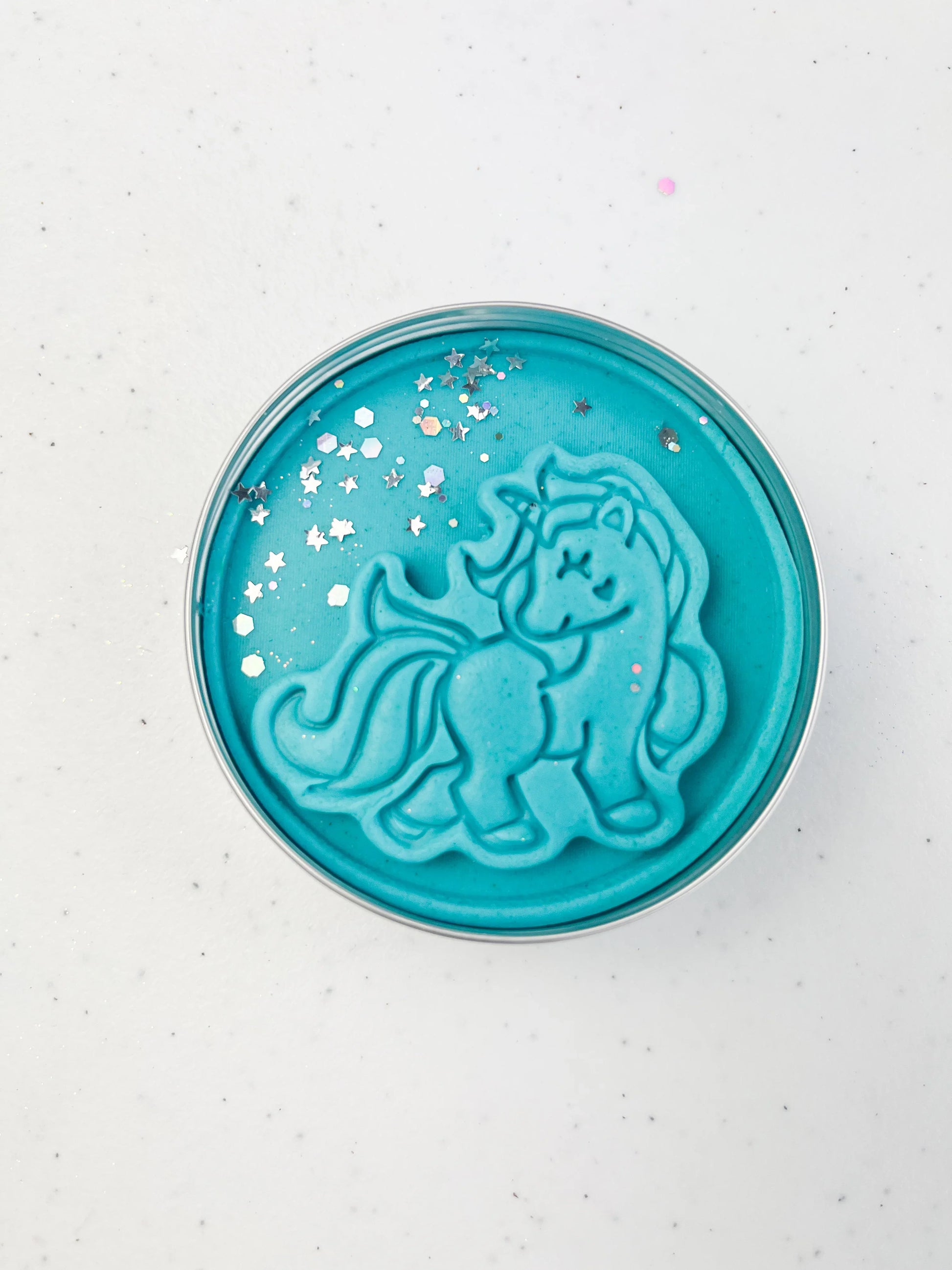 Tin of blue Playdough with unicorn design for unicorn themed kids birthday party favours