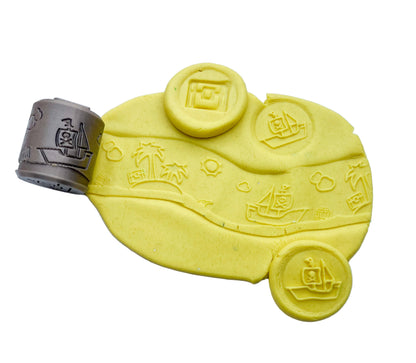 plastic free eco roller with pirate themed imprints showing pirate shapes on yellow playdough with this tool